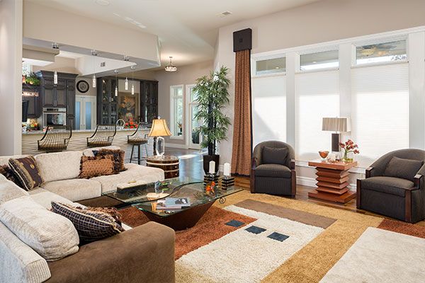 Open concept family room with white walls. 