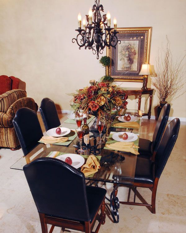 White Rug with black chairs and light walls. 