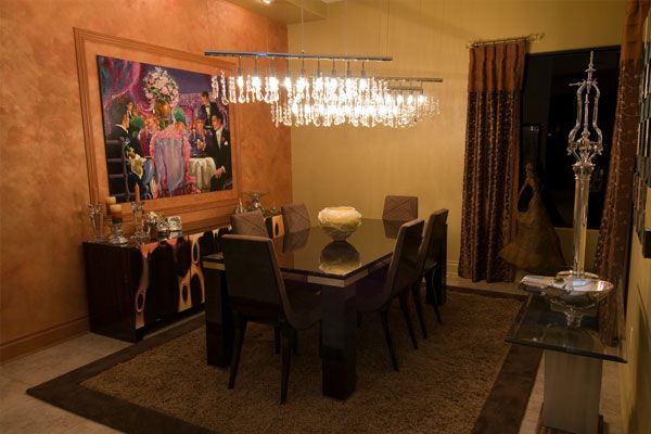 Dark brown rug under a dark wooden table. 
