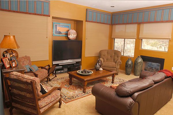 Yellow walls with light colored carpet. 