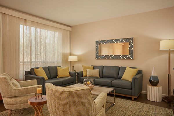 Dark wood floors with light colored walls. 