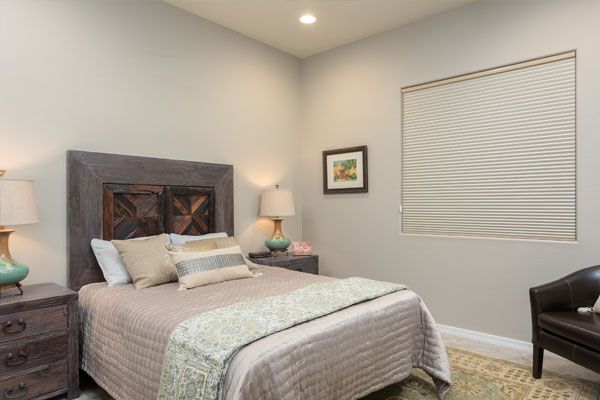 bedroom with Grey walls with brightness