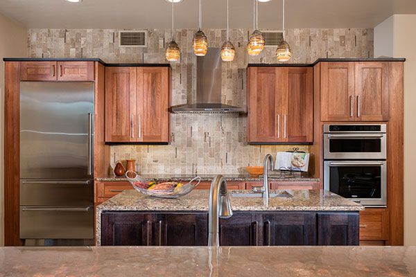 wooden kitchen cabinets with modern appliances. 