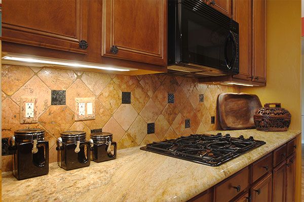 tile walls behind kitchen stove top. 