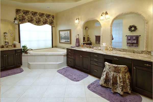 Yellow walls with white bathroom floor. 