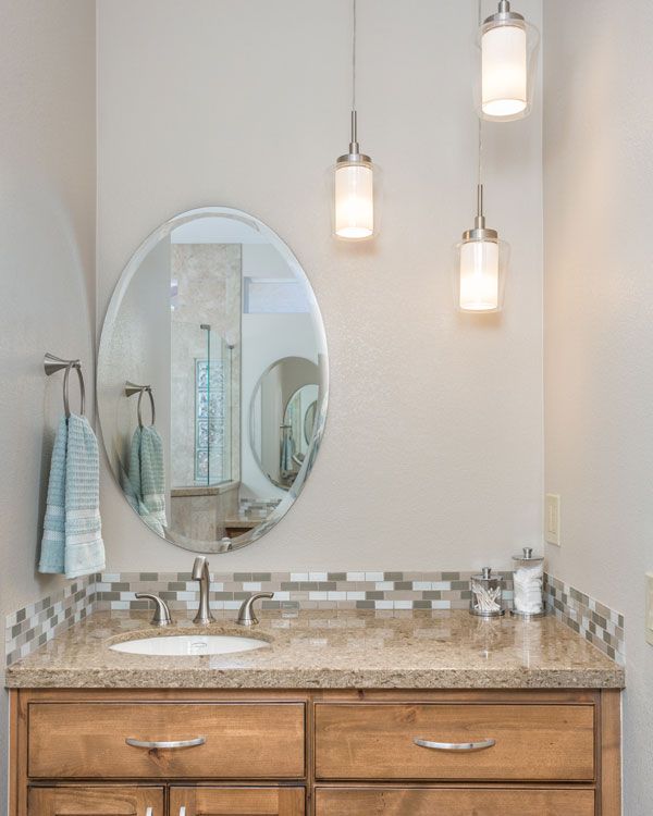 Light colored walls with marbled counter top. 