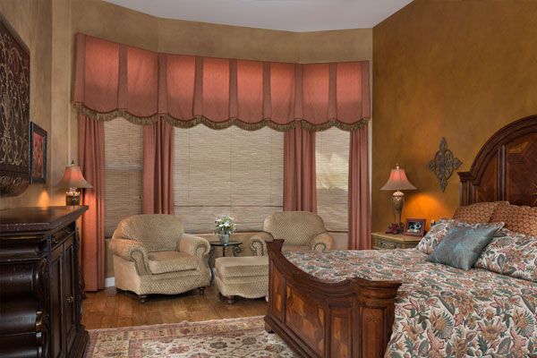 bedroom with a rug and wood floors. 
