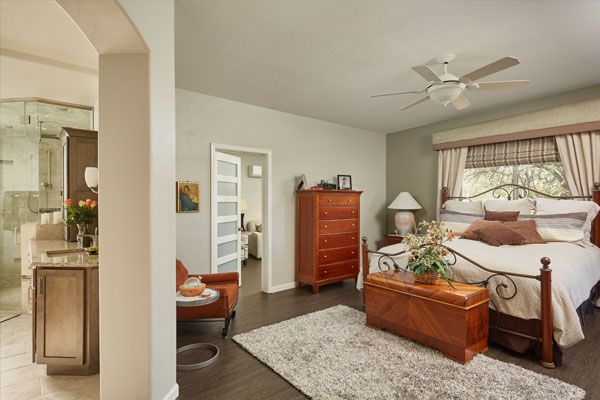 dark wood floors and light green walls. 