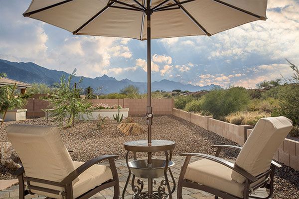 Back patio with an umbrella. 