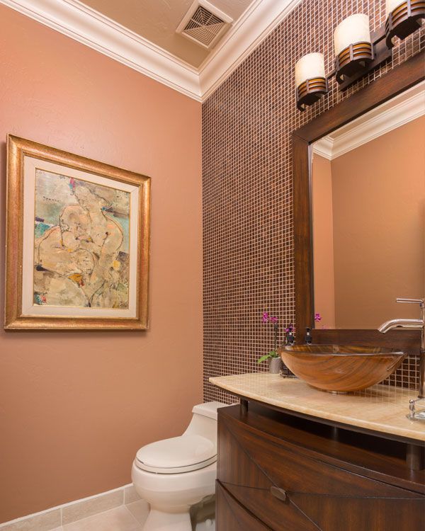 Light colored walls in a powder room. 