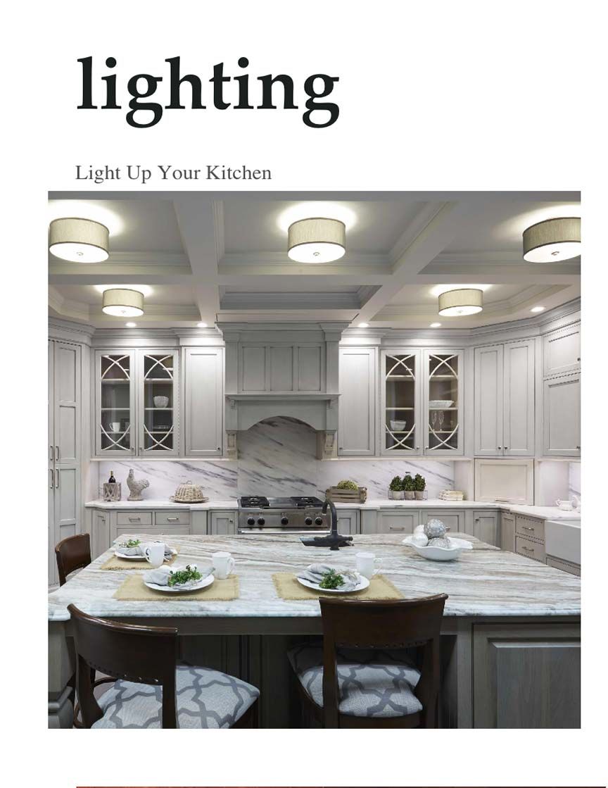 Kitchen with marbled top and white cabinets. 