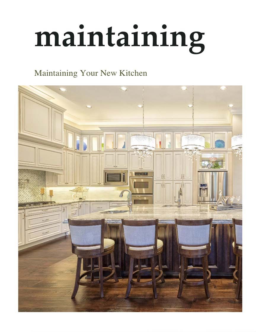 A kitchen with dark wood floors and chairs around a large island. 