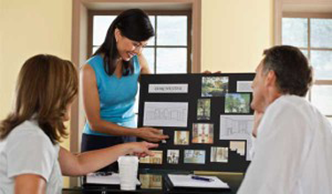 Woman showing a couple some interior design ideas in Tucson.