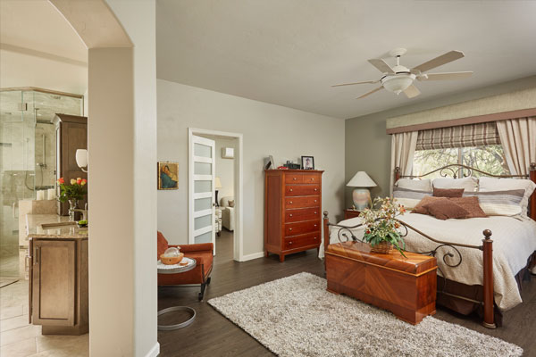 dark wood floors and light green walls.