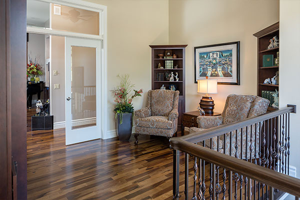 Wooden floors with white walls.