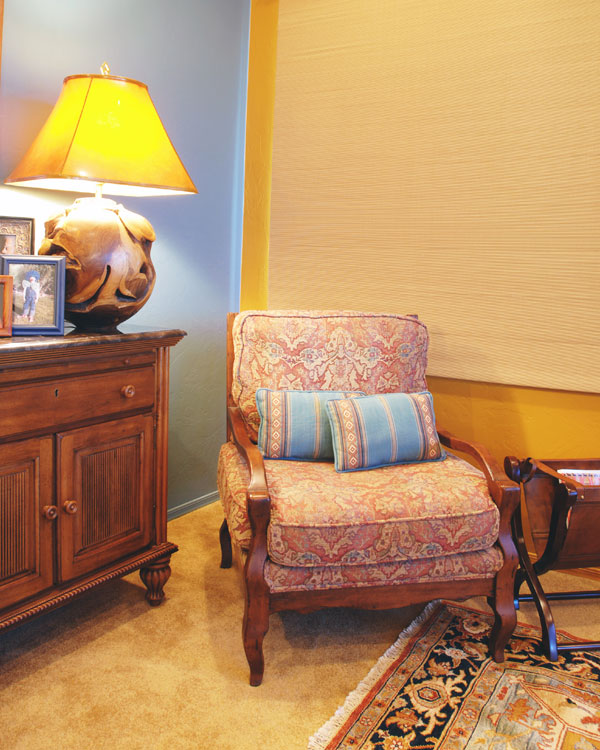 Yellow and blue walls with a rug.