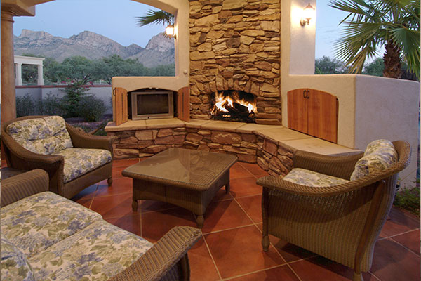dark red back patio with a fireplace.